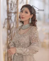 Start your new life by wearing DeemasFashion. Make your moment more memorable with light fawn heavy maxi nikah wear which is laboriously hand-rendered with silver and the same colour embroidery that enhances tilla, dabka, kora and crystal. The boat shape neckline and full sleeves of this maxi also add memorable beauty to your Qabool Hai moment. The maxi of this nikah wear is systemized with a dupatta in the same colour which is ornamented with four-sided borders and sequins sprayed all over to enhance the attractiveness of the nikah wear.