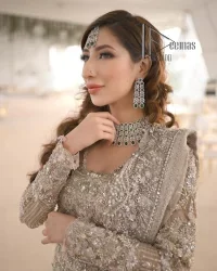 Start your new life by wearing DeemasFashion. Make your moment more memorable with light fawn heavy maxi nikah wear which is laboriously hand-rendered with silver and the same colour embroidery that enhances tilla, dabka, kora and crystal. The boat shape neckline and full sleeves of this maxi also add memorable beauty to your Qabool Hai moment. The maxi of this nikah wear is systemized with a dupatta in the same colour which is ornamented with four-sided borders and sequins sprayed all over to enhance the attractiveness of the nikah wear.