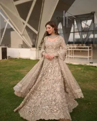 Start your new life by wearing DeemasFashion. Make your moment more memorable with light fawn heavy maxi nikah wear which is laboriously hand-rendered with silver and the same colour embroidery that enhances tilla, dabka, kora and crystal. The boat shape neckline and full sleeves of this maxi also add memorable beauty to your Qabool Hai moment. The maxi of this nikah wear is systemized with a dupatta in the same colour which is ornamented with four-sided borders and sequins sprayed all over to enhance the attractiveness of the nikah wear.