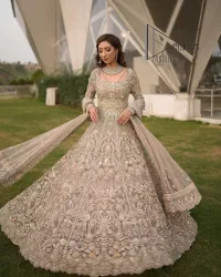 Start your new life by wearing DeemasFashion. Make your moment more memorable with light fawn heavy maxi nikah wear which is laboriously hand-rendered with silver and the same colour embroidery that enhances tilla, dabka, kora and crystal. The boat shape neckline and full sleeves of this maxi also add memorable beauty to your Qabool Hai moment. The maxi of this nikah wear is systemized with a dupatta in the same colour which is ornamented with four-sided borders and sequins sprayed all over to enhance the attractiveness of the nikah wear.