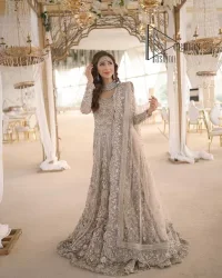 Start your new life by wearing DeemasFashion. Make your moment more memorable with light fawn heavy maxi nikah wear which is laboriously hand-rendered with silver and the same colour embroidery that enhances tilla, dabka, kora and crystal. The boat shape neckline and full sleeves of this maxi also add memorable beauty to your Qabool Hai moment. The maxi of this nikah wear is systemized with a dupatta in the same colour which is ornamented with four-sided borders and sequins sprayed all over to enhance the attractiveness of the nikah wear.
