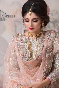 Don't worry, just be lilac on your nikah. As lilac is the most demanding nikah dress so DeemasFashion presents this nikah dress. Begin this with a lilac blouse which is diligently adorned with multi-colour embroidery to enhance the beauty of the nikah dress. Furthermore, it comes with boat shape neckline and full sleeves which are again highlighted with kora, dabka, tilla and crystal. The nikah dress is organized with a layered lehenga which is adorned with heavy embroidery all over. Complete this nikah dress with a scalloped dupatta which is sprinkled with sequins all over it. It is further furnished with a four-sided scalloped border.