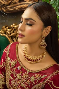 Maroon is the colour language to show bold and cuteness at the same time. DeemasFashion presents this Pakistani reception wear in the beautiful shade of maroon. Starting this Pakistani reception wear full-length Anarkali which is meticulously hand-rendered with golden embroidery which enhances the tilla, dabka, kora and Kundan to make your day with full confidence. Furthermore, it is highlighted with three-quarter sleeves and boat shape neckline. The Anarkali of this Pakistani reception wear is organized with a dupatta in the same colour which is embellished with four-sided borders and sequins sprayed all over.