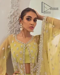 The love we share will make her mehndi day super duper amazing. This mehndi wears an olive front open shirt which is laboriously hand-rendered with a silver embroidery involving tilla, dabka, kora and Sitara. Further, the sweetheart shape neckline fulfils the dreamy look of the bride when comes with cape sleeves. The following shirt of mehndi wear is systemized with crushed sharara which is so simple and unique. Finishing this mehndi wear with a pleated dupatta that is maintaining a balance between outfits.