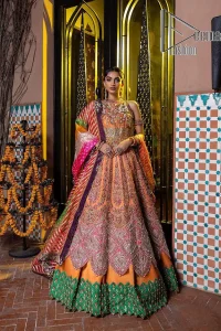 In a world full of trends, sometimes a bride just wants to wear something classic and traditional. In this way, DeemasFashion presents the major Pakistani walima dress which is nearest to the traditional style. The Pakistani walima dress starts from the orange pishwas which is beautifully styled with an illusion neckline and sleeveless. Further, it is enhanced with colourful embroidery which includes kora, dabka, tilla and Sitara to make your day super special. Pakistani walima dress is systemized with lehenga in the same colour but has a heavy green border to add beauty to the dress. Complete this Pakistani walima dress with a colourful dupatta to meet the following traditional trend.