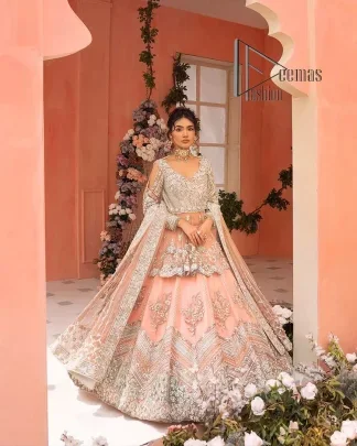 Feeling just peachy. DeemasFashion presents this peachy nikah outfit which begins with peplum in the peach colour. The following peplum is meticulously embellished with a silver embroidery which involves tilla, dabka, kora and Sitara. Further, the V shape neckline of the peplum looks as amazing as the embellished full sleeves. The Nikah outfit is coordinated with a fluffy lehenga having embellished borders and large floral motifs to make your day super peachy. Complete this nikah outfit with a dupatta which is adorned with four-sided embellished borders and floral motifs in the pattern.