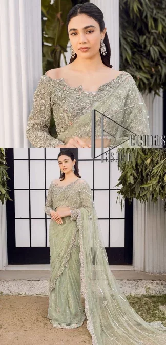 You go girl. Get you a handsome outfit that will wear matching robes. DeemasFashion presents this pistachio green saree to make you memorable in any event. It begins with a pistachio green blouse which is heavily ornamented with silver embroidery that magnifies tilla, dabka, kora and Zardozi. Further, the full sleeve style also enhances the beauty of the bridesmaid outfit when comes with boat shape neckline. Paired this blouse with a handsome and laborious saree whose scalloped border is embellished with a four-sided border and sequins spray all over to match your vibe.
