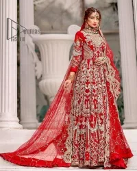 Marry someone who makes your heart shine. Wear what makes your soul shine. Introducing this Pakistani reception outfit which begins with a red blouse which is laboriously hand-rendered with silver embroidery to make your day super bright as silver colour. Further, it is highlighted with tilla, dabka, kora and crystal. The blouse of this Pakistani reception outfit is enhanced with boat shape neckline and three-quarter sleeves. The following blouse of the Pakistani reception outfit is systemized with a panelled lehenga in the same colour which is again heavily embellished. Complete this outfit with a frilled dupatta which is embellished with two-sided borders and sequins sprayed all over to make you shine.