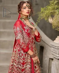 Marry someone who makes your heart shine. Wear what makes your soul shine. Introducing this Pakistani reception outfit which begins with a red blouse which is laboriously hand-rendered with silver embroidery to make your day super bright as silver colour. Further, it is highlighted with tilla, dabka, kora and crystal. The blouse of this Pakistani reception outfit is enhanced with boat shape neckline and three-quarter sleeves. The following blouse of the Pakistani reception outfit is systemized with a panelled lehenga in the same colour which is again heavily embellished. Complete this outfit with a frilled dupatta which is embellished with two-sided borders and sequins sprayed all over to make you shine.