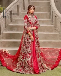 Marry someone who makes your heart shine. Wear what makes your soul shine. Introducing this Pakistani reception outfit which begins with a red blouse which is laboriously hand-rendered with silver embroidery to make your day super bright as silver colour. Further, it is highlighted with tilla, dabka, kora and crystal. The blouse of this Pakistani reception outfit is enhanced with boat shape neckline and three-quarter sleeves. The following blouse of the Pakistani reception outfit is systemized with a panelled lehenga in the same colour which is again heavily embellished. Complete this outfit with a frilled dupatta which is embellished with two-sided borders and sequins sprayed all over to make you shine.
