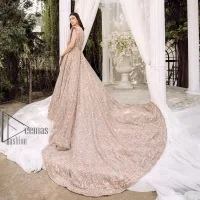 Boost your day with all about rose pink! Presenting the rose pink walima wear which begins with a heavy maxi that is beautifully hand-rendered with silver embroidery. It is attractively highlighted with tilla, dabka, kora and zardozi. The astonishing sleeveless style of the maxi looks super amazing when comes with a sweetheart neckline to make your day booster day. Furthermore, the back train of the maxi is also heavily ornamented. The walima wear is exquisitely paired up with a dupatta in the same colour which is embellished with four-sided borders and sequins sprayed all over.