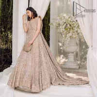 Boost your day with all about rose pink! Presenting the rose pink walima wear which begins with a heavy maxi that is beautifully hand-rendered with silver embroidery. It is attractively highlighted with tilla, dabka, kora and zardozi. The astonishing sleeveless style of the maxi looks super amazing when comes with a sweetheart neckline to make your day booster day. Furthermore, the back train of the maxi is also heavily ornamented. The walima wear is exquisitely paired up with a dupatta in the same colour which is embellished with four-sided borders and sequins sprayed all over.