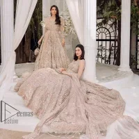 Boost your day with all about rose pink! Presenting the rose pink walima wear which begins with a heavy maxi that is beautifully hand-rendered with silver embroidery. It is attractively highlighted with tilla, dabka, kora and zardozi. The astonishing sleeveless style of the maxi looks super amazing when comes with a sweetheart neckline to make your day booster day. Furthermore, the back train of the maxi is also heavily ornamented. The walima wear is exquisitely paired up with a dupatta in the same colour which is embellished with four-sided borders and sequins sprayed all over.