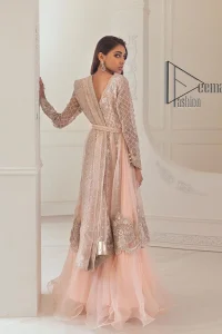 Every girl has a favourite deal with rose pink So DeemasFashion initiate this nikah wear in rose pink colour to embrace the love of brides. Starting this nikah wear with a pishwas which is beautifully styled with a double layer. The first layer is handsomely embellished with silver embroidery that includes tilla, kora, dabka and crystal. The other layer is beautifully styled with frill. Complete this nikah wear with a dupatta in the same colour adorned with a four-sided embellished border and sequins sprayed all over to make your nikah more memorable.