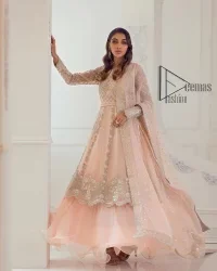 Every girl has a favourite deal with rose pink So DeemasFashion initiate this nikah wear in rose pink colour to embrace the love of brides. Starting this nikah wear with a pishwas which is beautifully styled with a double layer. The first layer is handsomely embellished with silver embroidery that includes tilla, kora, dabka and crystal. The other layer is beautifully styled with frill. Complete this nikah wear with a dupatta in the same colour adorned with a four-sided embellished border and sequins sprayed all over to make your nikah more memorable.