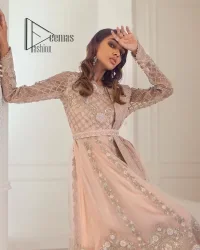 Every girl has a favourite deal with rose pink So DeemasFashion initiate this nikah wear in rose pink colour to embrace the love of brides. Starting this nikah wear with a pishwas which is beautifully styled with a double layer. The first layer is handsomely embellished with silver embroidery that includes tilla, kora, dabka and crystal. The other layer is beautifully styled with frill. Complete this nikah wear with a dupatta in the same colour adorned with a four-sided embellished border and sequins sprayed all over to make your nikah more memorable.