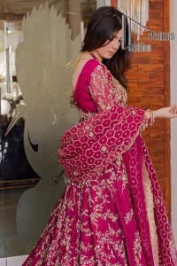 Stripes are the new pinky vibes. Introducing the Pakistani walima dress in the shade of shocking pink. This easy-breezy, romantic silhouette, is laboriously frosted with meticulously detailed golden embroidery which includes tilla, dabka, kora and Kundan. The handsome illusion neckline gives an extra soothing view to this Pakistani walima dress when comes with three-quarter sleeves. The heavily hand-rendered maxi is paired up with a dupatta in the same colour which is again embellished with four-sided borders and sequins sprayed all over to make your day super fresh.