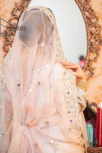 Confidence is wearing white on the big day. DeemasFashion presents the handsome and most attractive nikah outfit in white colour. Begin this nikah outfit with flared maxi which is beautifully decorated with light golden and silver embroidery involving kora, dabka, tilla and crystal to make your nikkah outfit super amazing. The round neckline of the nikah outfit laboriously comes with full sleeves. It is paired up with a dupatta in the same colour having a four-sided embellished border and sequin sprayed all over to increase your confidence with this nikah outfit.