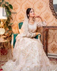 Confidence is wearing white on the big day. DeemasFashion presents the handsome and most attractive nikah outfit in white colour. Begin this nikah outfit with flared maxi which is beautifully decorated with light golden and silver embroidery involving kora, dabka, tilla and crystal to make your nikkah outfit super amazing. The round neckline of the nikah outfit laboriously comes with full sleeves. It is paired up with a dupatta in the same colour having a four-sided embellished border and sequin sprayed all over to increase your confidence with this nikah outfit.