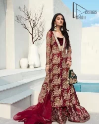 Walking into a new chapter of life with the joy of togetherness and the magic of love. A bright red long shirt is adorned with gorgeous motifs in gold. It is further encrusted with the real magic of tilla, dabka, and kora along with the sequins and pearls. The V shape neckline of this heavy long shirt adds more charm to the outfit when arrives with full sleeves. This beautiful reception piece is paired up with sharara in the same colour with attractive florals that are framed with pearls, Sitara and naqshi that draw the attention of the audience. Complete this article with a dupatta which is adorned with a heavy floral motif to balance the article.