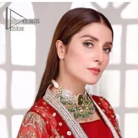 Walking into a new chapter of life with the joy of togetherness and the magic of love. A bright red long shirt is adorned with gorgeous motifs in gold. It is further encrusted with the real magic of tilla, dabka, and kora along with the sequins and pearls. The V shape neckline of this heavy long shirt adds more charm to the outfit when arrives with full sleeves. This beautiful reception piece is paired up with sharara in the same colour with attractive florals that are framed with pearls, Sitara and naqshi that draw the attention of the audience. Complete this article with a dupatta which is adorned with a heavy floral motif to balance the article.