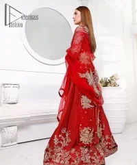 Walking into a new chapter of life with the joy of togetherness and the magic of love. A bright red long shirt is adorned with gorgeous motifs in gold. It is further encrusted with the real magic of tilla, dabka, and kora along with the sequins and pearls. The V shape neckline of this heavy long shirt adds more charm to the outfit when arrives with full sleeves. This beautiful reception piece is paired up with sharara in the same colour with attractive florals that are framed with pearls, Sitara and naqshi that draw the attention of the audience. Complete this article with a dupatta which is adorned with a heavy floral motif to balance the article.