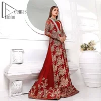 Walking into a new chapter of life with the joy of togetherness and the magic of love. A bright red long shirt is adorned with gorgeous motifs in gold. It is further encrusted with the real magic of tilla, dabka, and kora along with the sequins and pearls. The V shape neckline of this heavy long shirt adds more charm to the outfit when arrives with full sleeves. This beautiful reception piece is paired up with sharara in the same colour with attractive florals that are framed with pearls, Sitara and naqshi that draw the attention of the audience. Complete this article with a dupatta which is adorned with a heavy floral motif to balance the article.