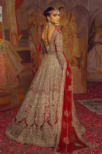 Encourage your reception day in this elegant yet classy deep red silhouette. Make your bridal look, in this deep red ensemble, heavenly adorned with golden embroidery highlighted with kora, dabka, zardozi,tilla, crystal, pearls and sequins. The heavily loaded embroidered border completes the look of the maxi. In addition to this, the V shape neckline along with full sleeves is such a graceful artistic look. It is paired up with this heavily loaded dupatta with intricately handcrafted borders, further enhanced with floral motifs and sequins spray all over to add a romantic and aesthetic look to this article.