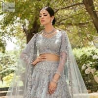 The magic of luxurious romantic outfits, giving you love at your Walima. The outfit defines the endless beauty of the immaculately produced pieces with intricate silver and golden embellishments, which are further magnified wth tilla, dabka, kora, Kundan and crystal. The full sleeve style of the blouse along with V shape neckline just gives you a unique way of artistic look. It is systemized with frilled lehenga which is heavily embellished with floral patterns to make your day more charming and delightful. Complete this article with a dupatta which is embellished with a four-sided border and ting floral motifs all over that are a dream of someone's special moment.