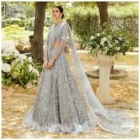 The magic of luxurious romantic outfits, giving you love at your Walima. The outfit defines the endless beauty of the immaculately produced pieces with intricate silver and golden embellishments, which are further magnified wth tilla, dabka, kora, Kundan and crystal. The full sleeve style of the blouse along with V shape neckline just gives you a unique way of artistic look. It is systemized with frilled lehenga which is heavily embellished with floral patterns to make your day more charming and delightful. Complete this article with a dupatta which is embellished with a four-sided border and ting floral motifs all over that are a dream of someone's special moment.