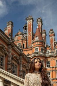 Filling the air with utmost happiness, joy ad fun for your Walima day. A handsome and attractive light fawn maxi laboriously roasted with meticulously detailed multiple colour hand embellishment which is further blooms with tilla, dabka, kora, naqshi and magic of Sitara. The jewel neckline of the following front open back train maxi looks so aesthetic when organized with three-quarter sleeves. It is paired up with lehenga in the same colour which is adorned with floral motifs and sequins spray spread all over to make your event more remarkable and shiny. Finish this article with the dupatta which is framed with magical four-sided borders and sequins sprayed all over to fulfil the dreamy fairy look.