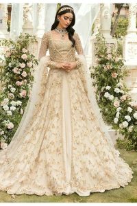 Mark your Nikah day in a calendar as a special one with this marvellous outfit. DeemasFashion presents this outfit in light fawn colour which begins with a back train scalloped maxi. The following maxi is sumptuously embellished with a golden embroidery which is further intensified with tilla, dabka, naqshi, Resham and zardozi. The sweetheart neckline of the maxi is heavily embellished and looks romantic when comes with full sleeves style. It is handsomely paired up with a lehenga in the same colour which is so plain to balance the look of the outfit. Finish this article with a scalloped dupatta which is embellished with four-sided borders and sequins sprayed all over to make your day more magical. 