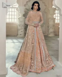 Be the happiest bride in your Walima as the orange colour is the most optimistic among all. The light orange front open maxi is complemented with delicate silver embroidery, further enhanced with the beautiful detailing which includes tilla, dabka, kora, Kundan and the real magic of crystal to make you the star of the show. The high neckline also looks like a unique masterpiece when it comes with full sleeves. It is organized with a flared lehenga that is also adorned with heavy embroidery. The flare of the following lehenga gives a dreamy fairy look to every bride. Complete this outfit with a scalloped dupatta in the same colour framed with four-sided borders and floral motifs all over to win the quote of the happiest bride.