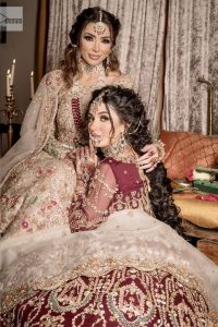 Take your style up a few notches in this elegant reception piece. A pure organza maroon fluffy lehnga is beautifully hand-rendered with golden embroidery and enhanced with  tilla, sitara, pearls, dabka and zardozi work. It is paired up with a blouse choli with tilla motifs on the full sleeves along with boat shape neckline to make your Big day astonishing and remarkable. The ivory organza dupatta has a four-sided embroidery adorned with pearls and Sitara and is framed with a scalloped style.