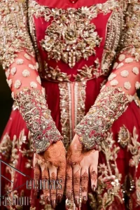 The magic of luxurious romantic silhouettes, giving out love and letting it come in. A maroon frilled maxi that is purely designed for your reception and hand-crafted with Sitara, pearls, tilla , and dabka along with the magic of zardozi. Further, it is handsomely ornamented with multiple embroideries to steal everyone's heart. The round shape neckline enhances the beauty of the outfit when comes with full sleeves to make you the star of the show. The front open style of the maxi truly makes you a unique bride of all eras.