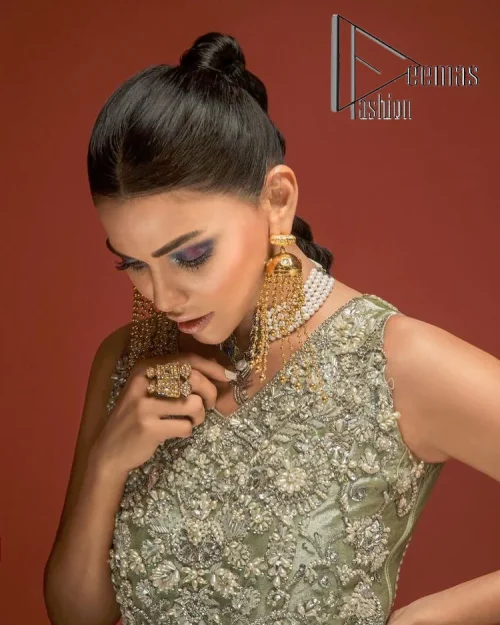 Celebrate your party events with DeemasFashion. An olive green shirt in tissue fabric, hand embellished with dabka, nakshi, cut dana,