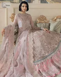 Define your true self with an outfit that speaks for its beauty. DeemasFashion introduces this rose pink maxi which is beautifully hand-crafted with silver embroidery encapsulated with tilla, dabka, kora, Kundan ad zardozi. The upper side of the maxi is adorned with tiny floral motifs to give you a sweet treat on your Walima day. Further, the high neckline along with full sleeves intensifies the beauty of the outfit. It is paired up with sharara which is best for your walima day to give you a memorable and unique look. Complete this article with a dupatta in the same colour which is adorned with a four-side border to define your self-love.