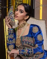 Embodying grace with iridescent glamour. This royal blue party outfit from DeemasFashion will turn heads. It is appealing with multiple colour embroidery all over which is further enhanced with tilla, dabka, kora and the real magic of zardozi. The square neckline of the fit and flare maxi will give life to your whole attire at any party. Further, the following maxi has full sleeves which are ornamented with handsome details of hand embroidery. The floral motifs also make the attire magnificent and more glorious which hits all the right hearts.