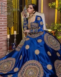 Embodying grace with iridescent glamour. This royal blue party outfit from DeemasFashion will turn heads. It is appealing with multiple colour embroidery all over which is further enhanced with tilla, dabka, kora and the real magic of zardozi. The square neckline of the fit and flare maxi will give life to your whole attire at any party. Further, the following maxi has full sleeves which are ornamented with handsome details of hand embroidery. The floral motifs also make the attire magnificent and more glorious which hits all the right hearts.