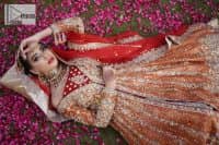 Shine bright in the sparkling ensemble from DeemasFashion. Introducing this reception outfit which begins with a rust pishwas.  This front en pishwas dipped in the richest shade of rust and is ornamented with golden embroidery which is further intensified with tilla, dabka, sequins and the real magic of zardozi. The strap neckline of the pishwas gives a unique aesthetic sense when comes with full sleeves. It is coordinated with an ivory lehenga whose border is embellished with golden embroidery. Finish this article with a dupatta framed with a four-sided embroidered border and sequin sprayed all over.