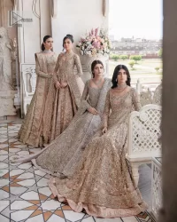 Make your Nikah look pop with the unique pieces from DeemasFashion. This pishwas is hand-embellished with multiple colour embroidery and lavish designs. Pearls, tilla, dabka, kora, zardozi and sequins give a glamorous touch to this Pishwas. The V neckline of the following pishwas archives a finished look. Further, the full sleeves balance the look of the outfit to make your day charming and beautiful. It is coordinated with floor length lehenga and is also embellished to make this stunning attire a breathtaking choice to wear on the most important day of your life. Finish this with a dupatta framed with four-sided borders and sequins sprayed all over.