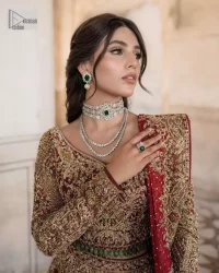 This intricate floral pattern is mirrored on a dreamy canvas to elevate your looks! The blouse in a bright red shade is a traditional attire to pair with a lehenga. The blouse is fully emblazoned with tilla, dabka, kora Kundan and crystals. Intricate designs and fine details of light golden embroidery give a perfect finishing look to the blouse. The boat shape neckline gives a stunning touch to the blouse. Further, Hand-crafted embellishments on full sleeves also add beauty to the outfit. It is systemized with can-can lehenga which is fully adorned with embroidery to fulfil the dreamy look. Finish this reception wear with a dupatta framed with four-sided embellished borders and sequins sprayed all over.