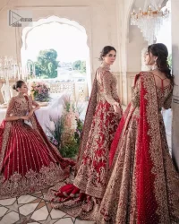 This intricate floral pattern is mirrored on a dreamy canvas to elevate your looks! The blouse in a bright red shade is a traditional attire to pair with a lehenga. The blouse is fully emblazoned with tilla, dabka, kora Kundan and crystals. Intricate designs and fine details of light golden embroidery give a perfect finishing look to the blouse. The boat shape neckline gives a stunning touch to the blouse. Further, Hand-crafted embellishments on full sleeves also add beauty to the outfit. It is systemized with can-can lehenga which is fully adorned with embroidery to fulfil the dreamy look. Finish this reception wear with a dupatta framed with four-sided embellished borders and sequins sprayed all over.