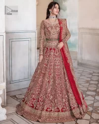 This intricate floral pattern is mirrored on a dreamy canvas to elevate your looks! The blouse in a bright red shade is a traditional attire to pair with a lehenga. The blouse is fully emblazoned with tilla, dabka, kora Kundan and crystals. Intricate designs and fine details of light golden embroidery give a perfect finishing look to the blouse. The boat shape neckline gives a stunning touch to the blouse. Further, Hand-crafted embellishments on full sleeves also add beauty to the outfit. It is systemized with can-can lehenga which is fully adorned with embroidery to fulfil the dreamy look. Finish this reception wear with a dupatta framed with four-sided embellished borders and sequins sprayed all over.