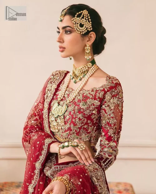 This outfit is a stand-out look for the Pakistani reception, this ensemble consists of a bright red-hued lehenga choli. This