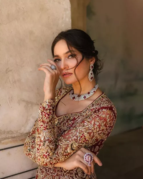 Bright and blissful! This ensemble is the epitome of grace. The maxi is fully emblazoned with tilla, dabka, kora, Kundan