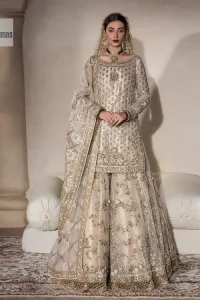 Unravel your inner density with our ivory nikah outfit. DeemasFashion presents this outfit which is embellished with light golden embroidery that further intensifies with tilla, dabka, kora, Kundan and the real magic of Zardozi. The ivory short shirt has boat shape neckline that is the epitome of royalty and grace. In addition to this, the embellished full sleeves also give a stunning touch to the shirt. It is coordinated with scalloped sharara making it a perfect choice to pair with the short shirt. Finish this outfit with a dupatta framed with four-sided embellished borders that gives you an impressive appearance on the Big day.