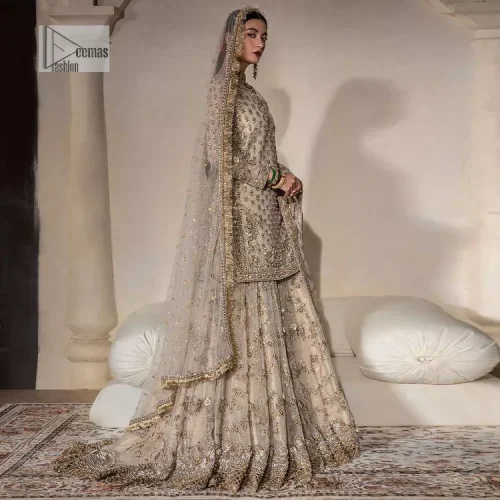 Unravel your inner density with our ivory nikah outfit. DeemasFashion presents this outfit which is embellished with light golden embroidery