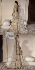 Unravel your inner density with our ivory nikah outfit. DeemasFashion presents this outfit which is embellished with light golden embroidery that further intensifies with tilla, dabka, kora, Kundan and the real magic of Zardozi. The ivory short shirt has boat shape neckline that is the epitome of royalty and grace. In addition to this, the embellished full sleeves also give a stunning touch to the shirt. It is coordinated with scalloped sharara making it a perfect choice to pair with the short shirt. Finish this outfit with a dupatta framed with four-sided embellished borders that gives you an impressive appearance on the Big day.