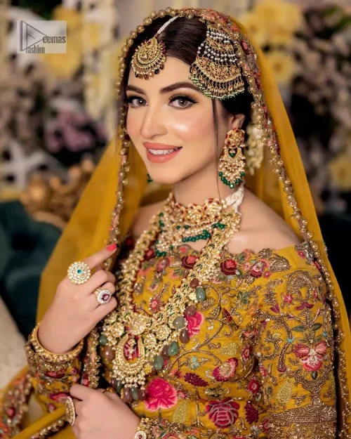 Take your style quotient up a few notches in this exquisite mehndi outfit! ]The maxi in mustard colour is a